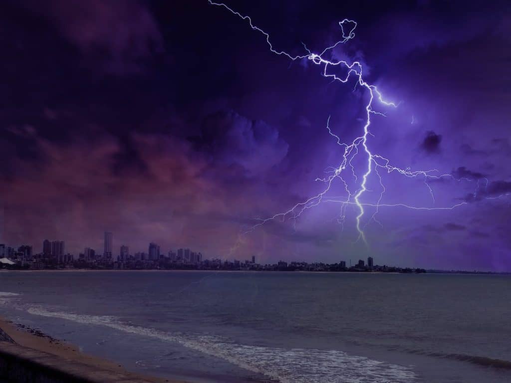 Lightning Phenomenon Near City And Ocean